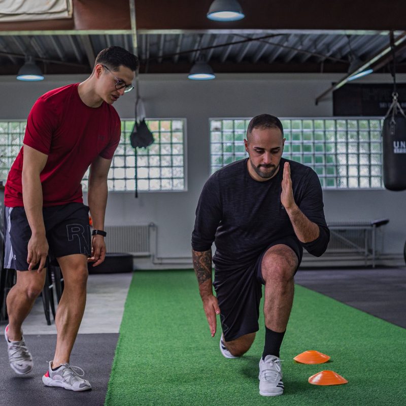 personal trainer advising a client