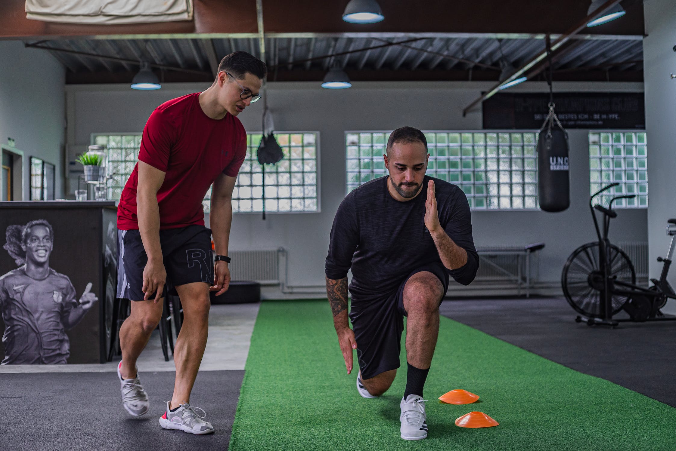 personal trainer advising a client